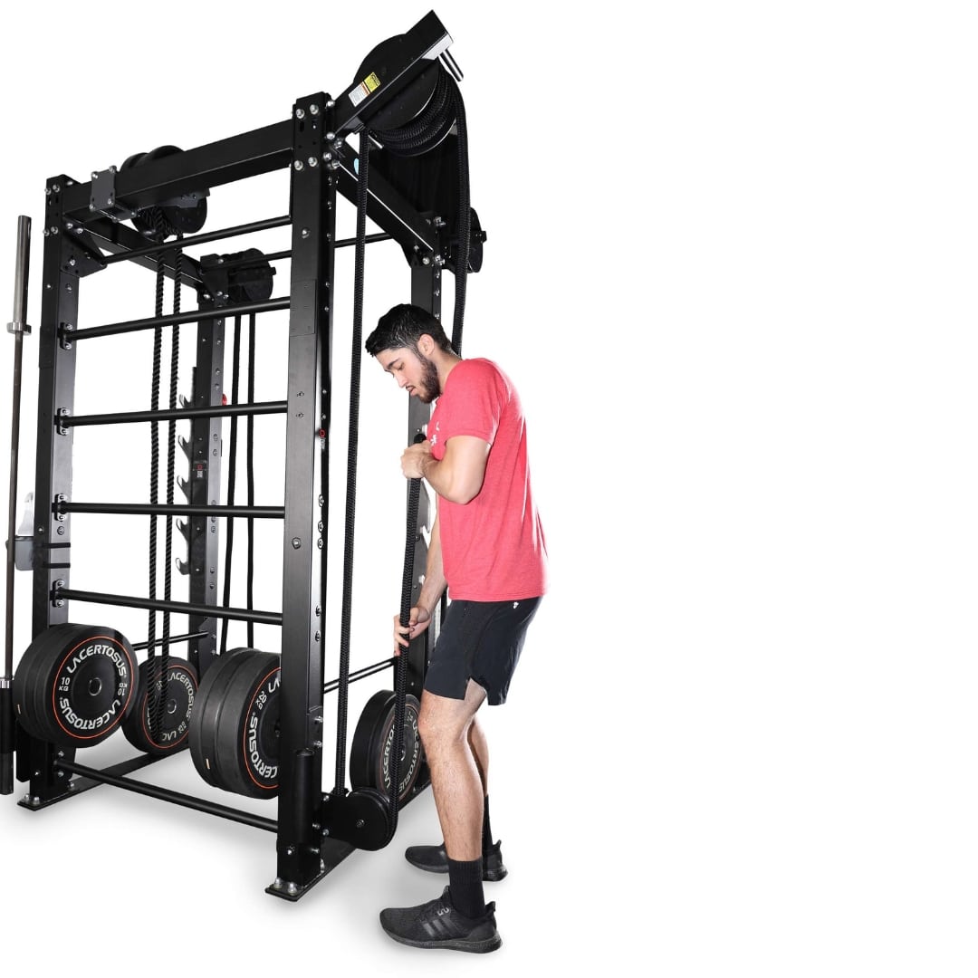 Man using InertiaWave exercise equipment in a red shirt and black shorts.