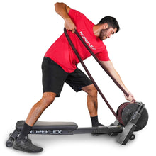 Man using Ropeflex rope trainer in red shirt for fitness workout.