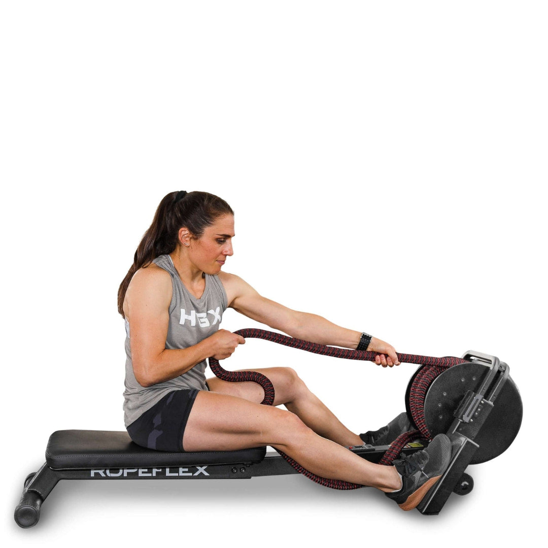 Woman using Ropeflex RX2300 rope trainer for fitness workout.