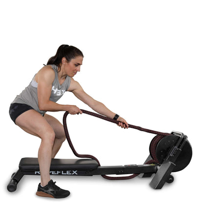 Woman using Ropeflex RX2100 trainer with red rope for full-body workout.