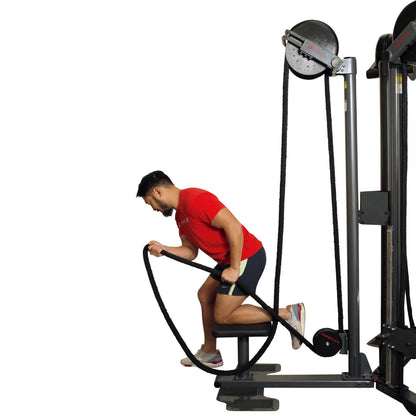 Man exercising on a Ropeflex gym machine in a red shirt, performing a rope pull workout.
