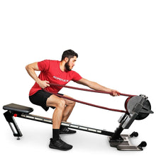 Man using ROPEFLEX RX2300 rope trainer for fitness workout.