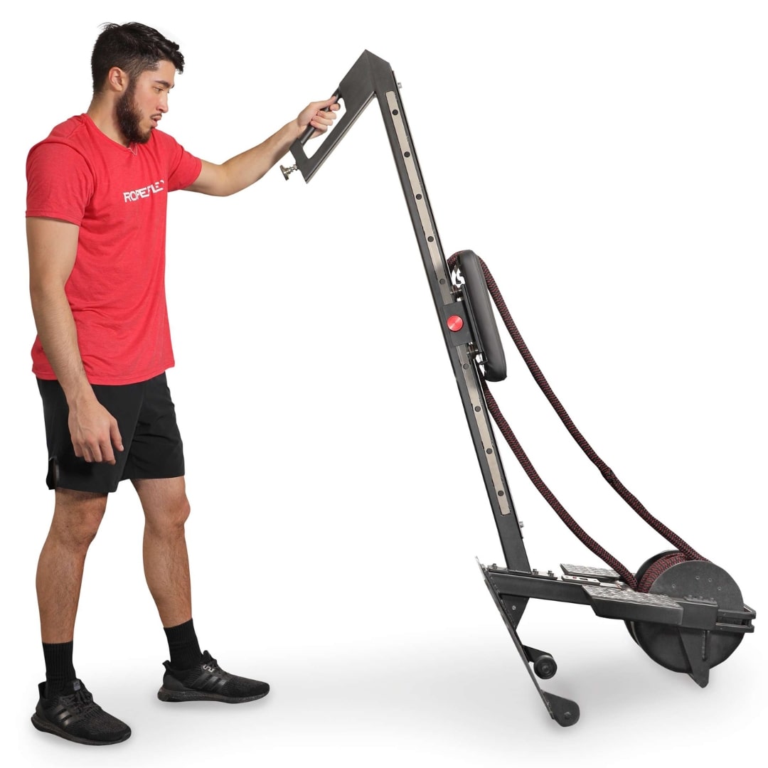 Man using Ropeflex RX2100 exercise machine with adjustable resistance ropes.