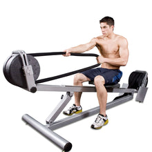 Man using rowing machine for exercise in gym.