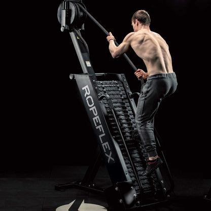 Man exercising on ROPEFLEX machine, shirtless, showcasing muscle definition.