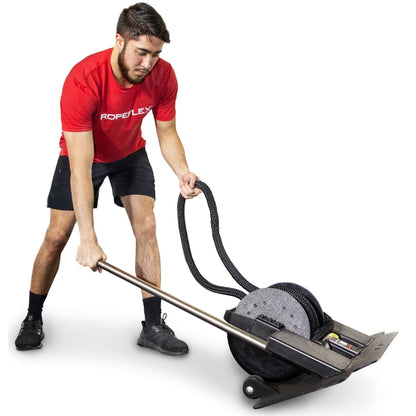 Man using Ropeflex fitness machine with a black rope for strength training.