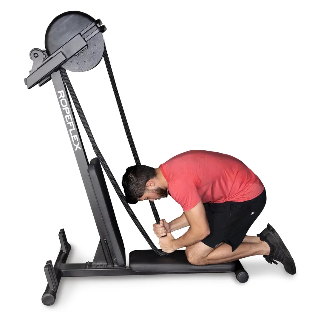 Man using Ropeflex machine for rope pulling exercise.
