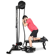 Man using Ropeflex RX4400 rope trainer in a kneeling position for strength training.
