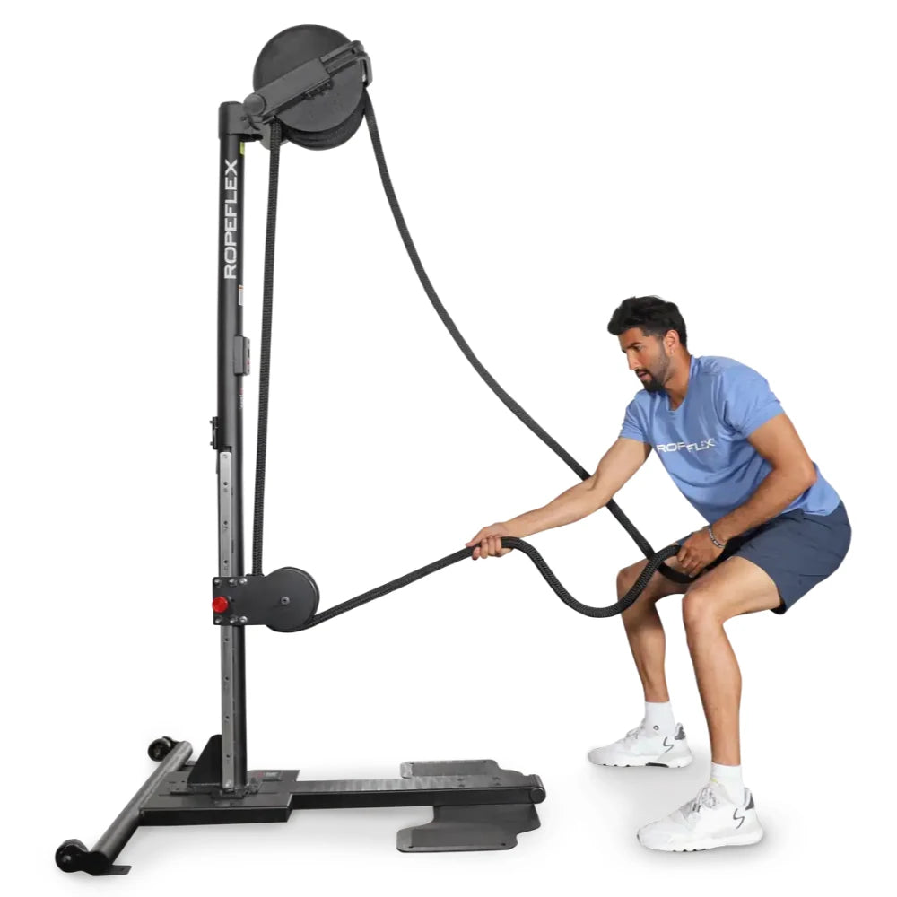 Man using Ropeflex RX2300 vertical rope trainer for fitness workout.