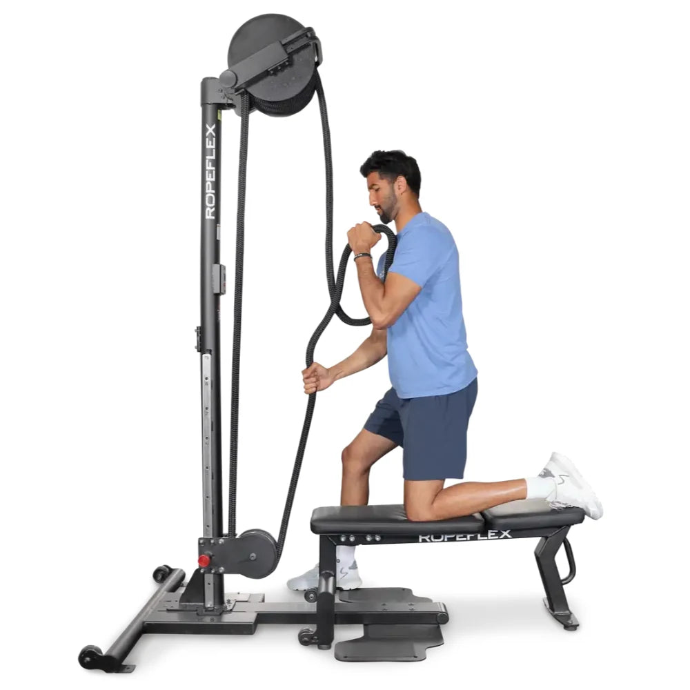 Man using Ropeflex rope trainer on bench for upper body workout.