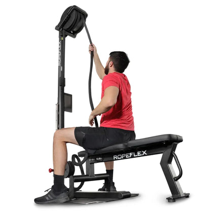 Man using ROPEFLEX RX2300 rope trainer in red shirt for upper body workout.