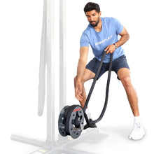 Man using Ropeflex exercise machine with black ropes.