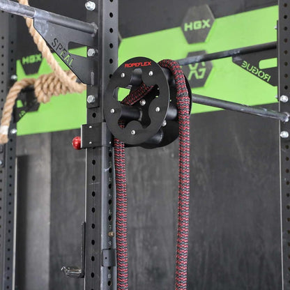 ROPEFLEX pulley system with red and black rope on gym equipment for strength training.