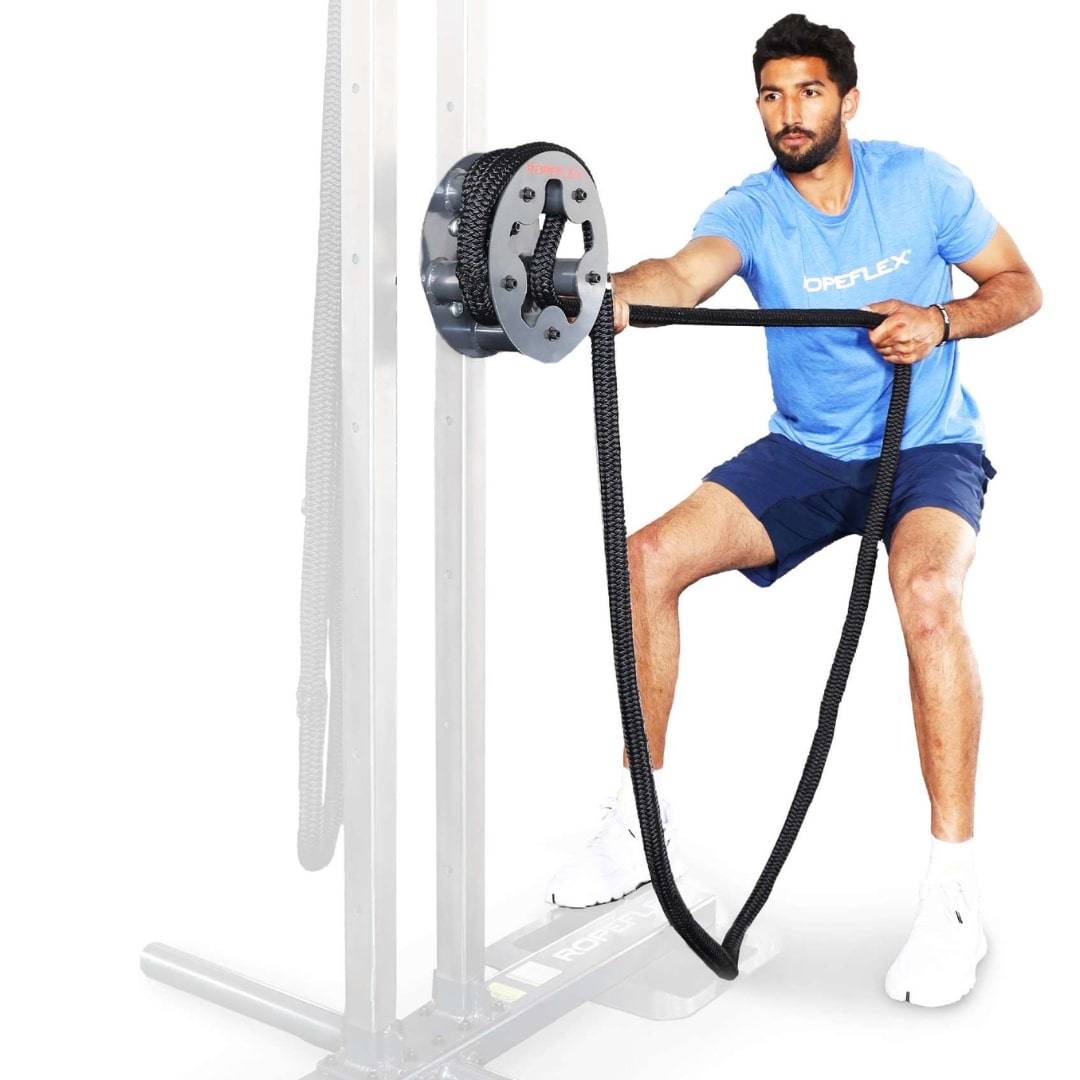 Man using Ropeflex RX4400 exercise machine with black rope for strength training.