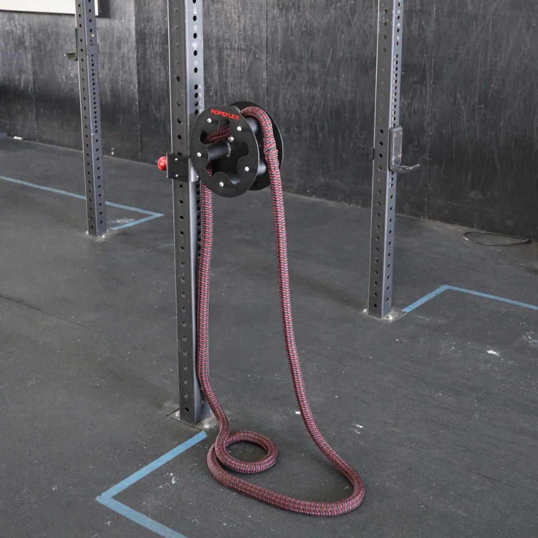 Ropeflex RX220 battle rope trainer with red and black rope attached to gym rig.