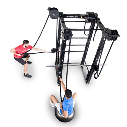 Ropeflex fitness equipment with two men exercising, featuring a pulley system and stability ball.