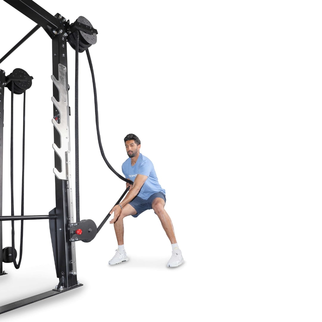 Man using Inertia Wave Pro battle ropes for exercise.