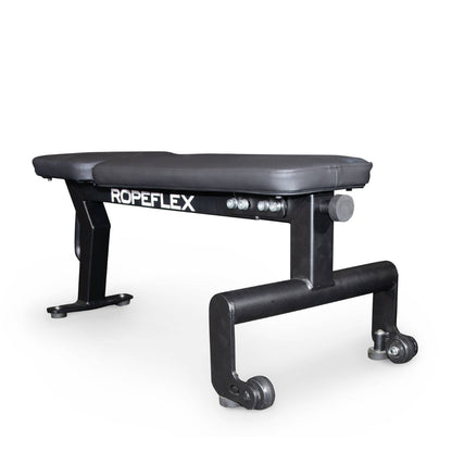 Ropeflex black flat bench with wheels for versatile gym workouts.
