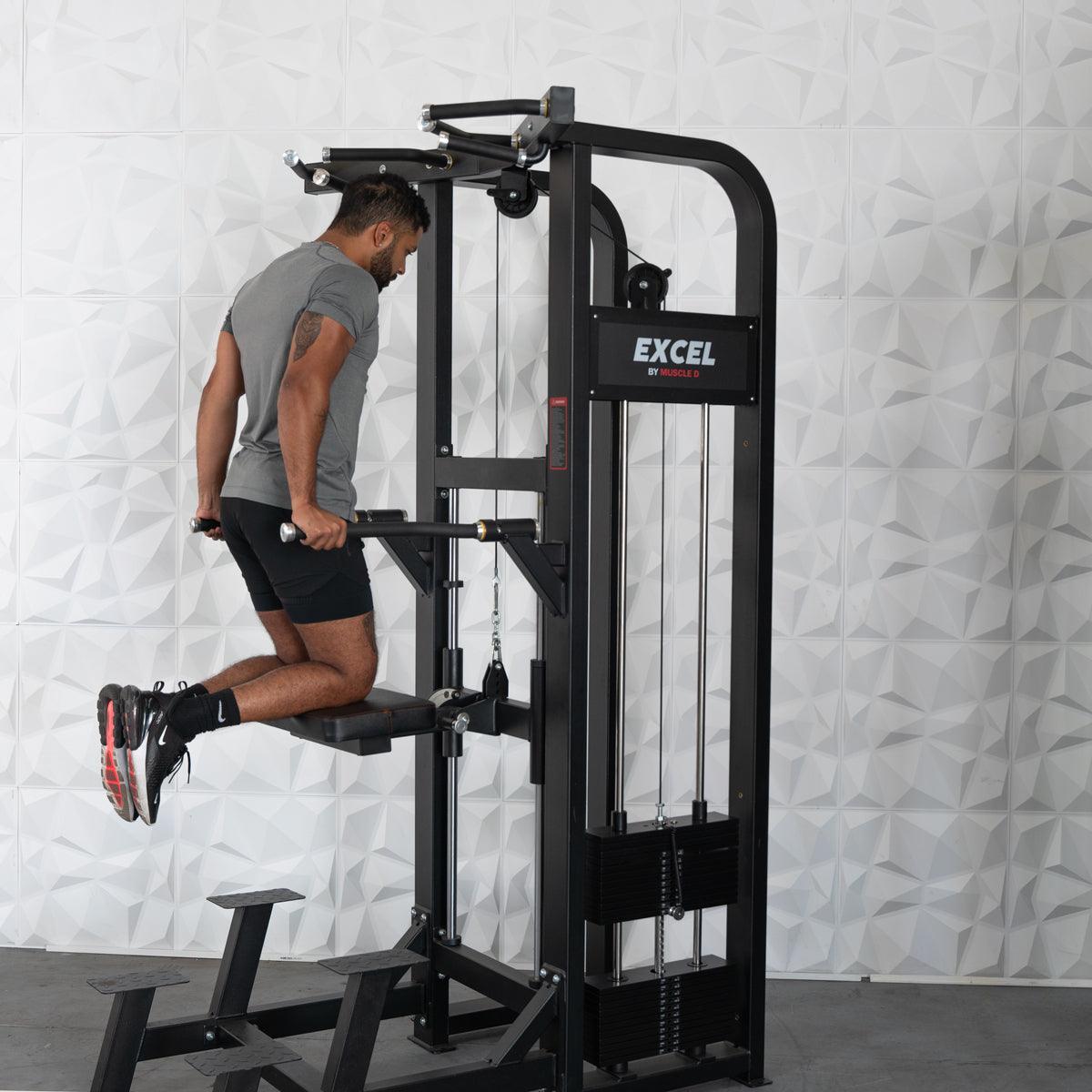 Man using Excel dip machine for tricep workout in gym.