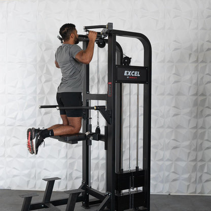 Man using Excel by Muscle D dip assist machine in gym.