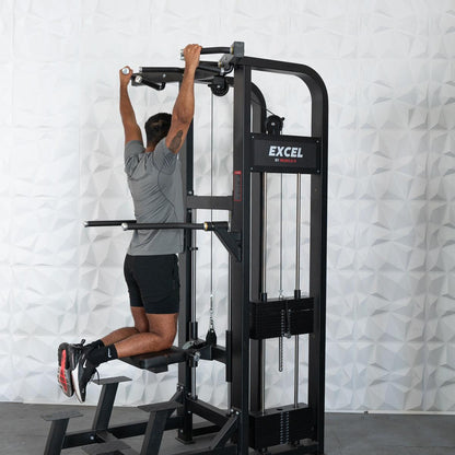 Man using Excel pull-up machine with padded knee support.