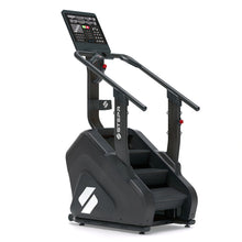 STEPR PRO – angled front-left view of commercial stair climber featuring oversized HD touchscreen, reinforced frame, and textured rotating steps for high-intensity cardio