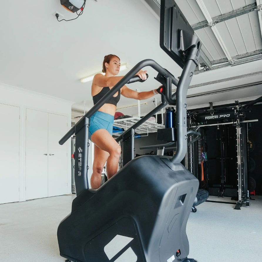 STEPR PRO – athlete powering through steep climb on PRO stair machine emphasizing smooth, continuous step motion