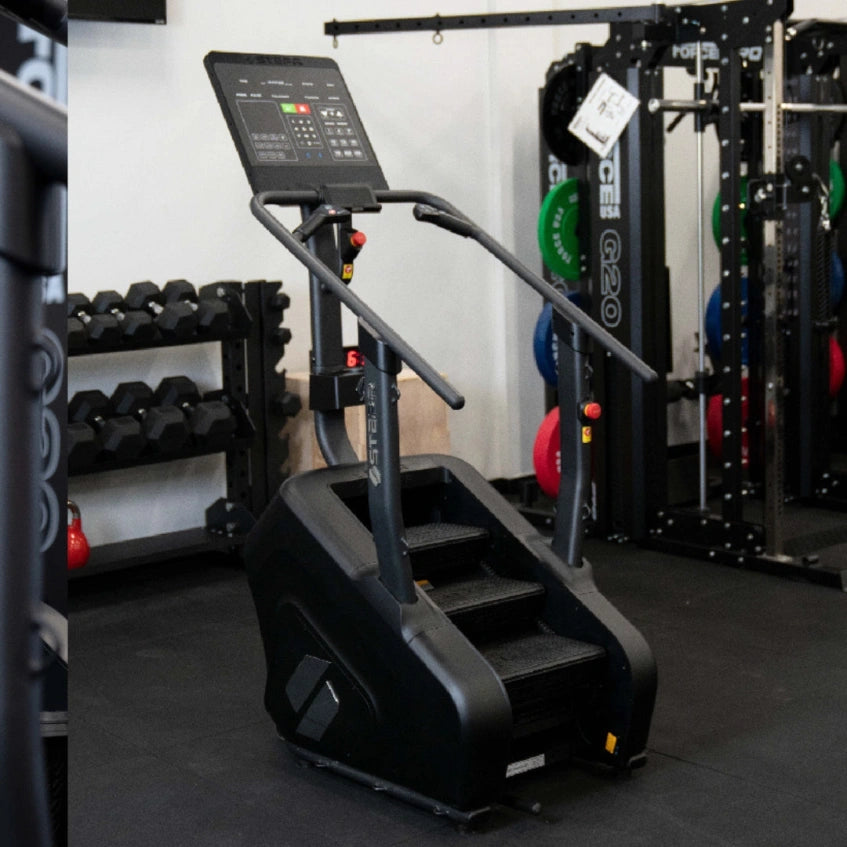 STEPR PRO – close-up of console interface, heart-rate sensors, and sturdy tubular handrails