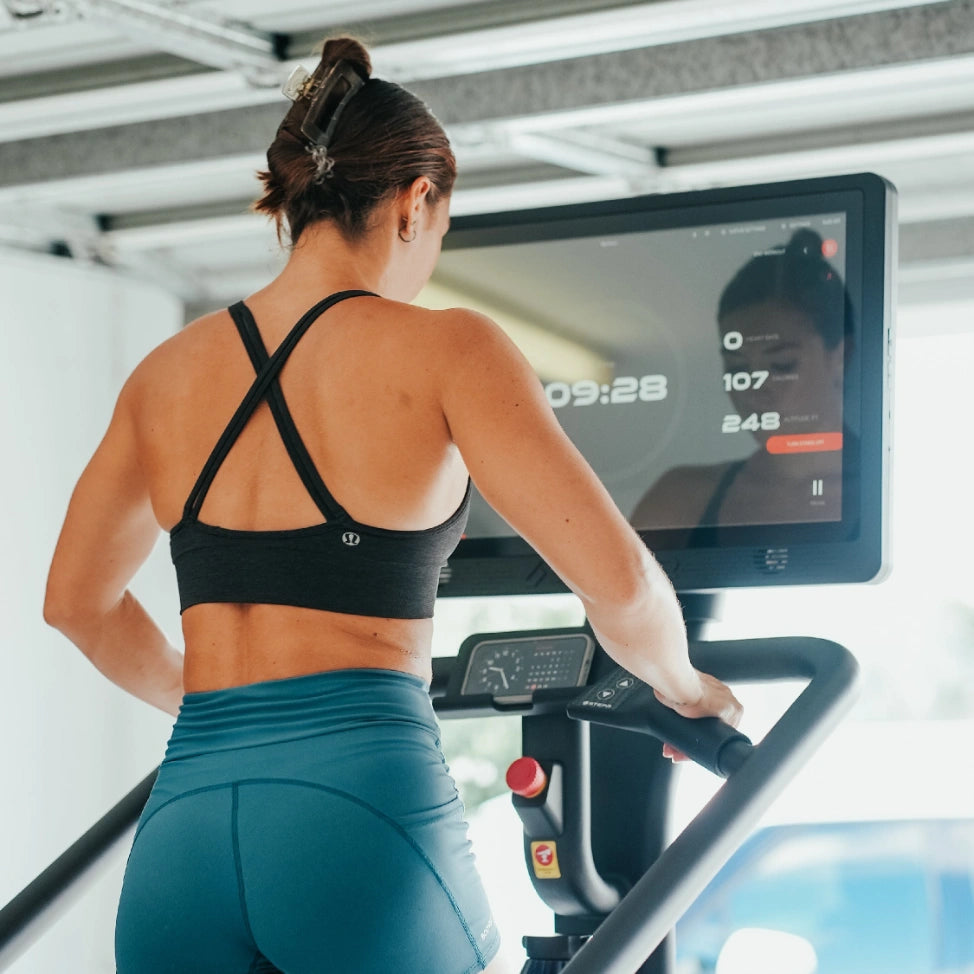 STEPR PRO – front-right perspective capturing robust stair cascade and high-contrast display screen