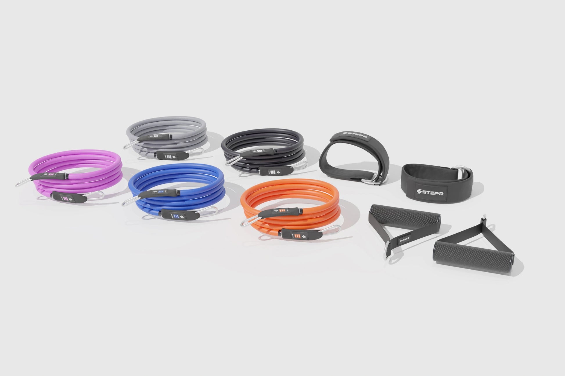STEPR Ultimate Accessory Pack – resistance bands and adjustable ankle cuffs displayed next to quick-start guide