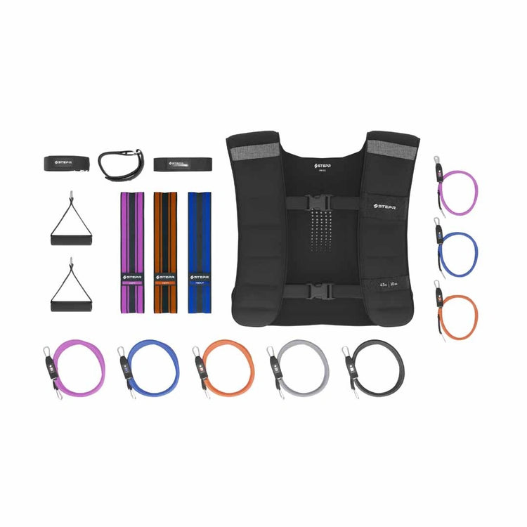 STEPR Ultimate Accessory Pack – complete six-piece bundle laid flat, including floor mat, resistance bands, ankle straps, phone holder, and cleaning kit for STEPR machines