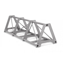 Gray elevated truss structure with triangular cross-bracing and integrated monkey bars, designed for functional training exercises.