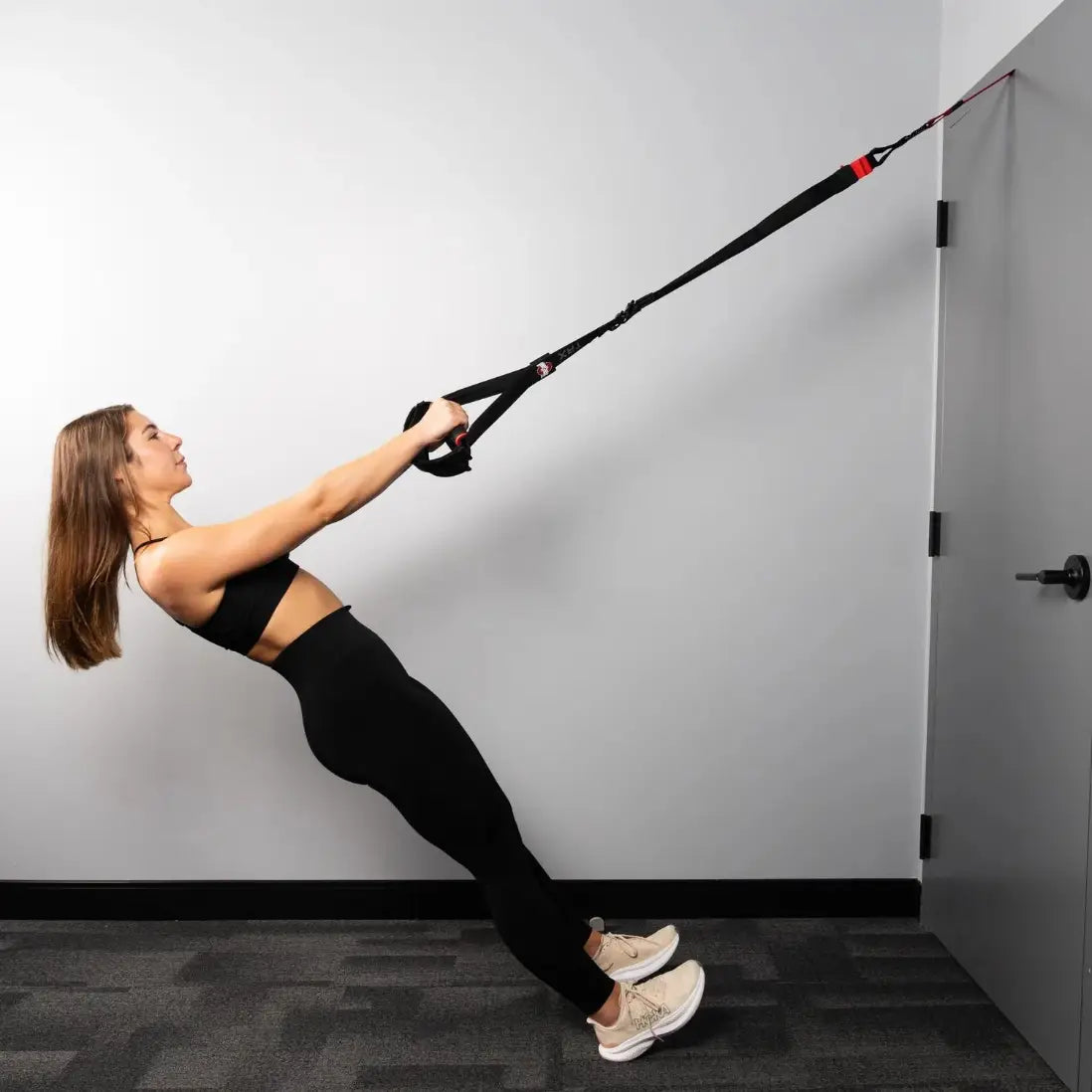 TRX Pro4 Ohio State Strap – rolled kit beside mesh pouch for portable Buckeye fitness