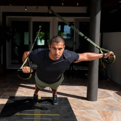 TRX Pro4 Suspension Trainer – angled view of camo straps and handles emphasizing textured rubber grips