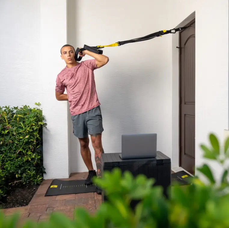 TRX Pro4 Suspension Trainer – close-up of yellow adjustable suspension straps with carabiner and anchor loop