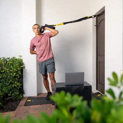TRX Pro4 Suspension Trainer – close-up of yellow adjustable suspension straps with carabiner and anchor loop