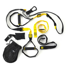 TRX Pro4 Suspension Trainer – yellow suspension straps with black handles laid flat on white background for full-body strength training