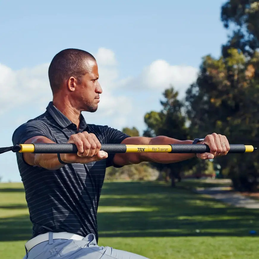 TRX Rip Trainer – training bar, resistance cord, and safety strap neatly arranged for dynamic core workouts