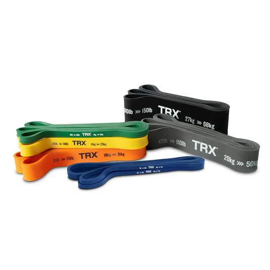 Bundle of TRX resistance bands in various colors and weights.