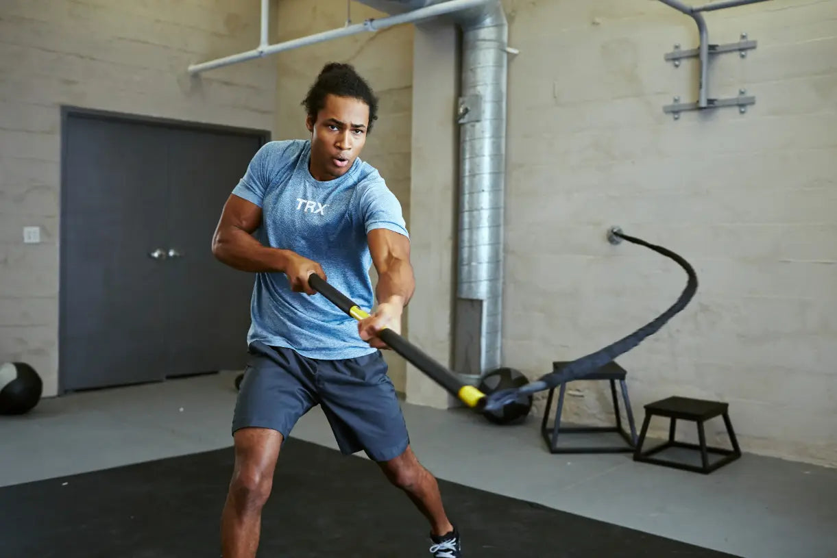 TRX Strong Suspension Trainer – neatly coiled straps and accessories arranged for storage