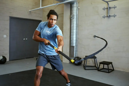 TRX Strong Suspension Trainer – neatly coiled straps and accessories arranged for storage