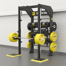 TRX Studio Line Strength Bay – commercial bay loaded with barbells, bumper plates, and pull-up stations