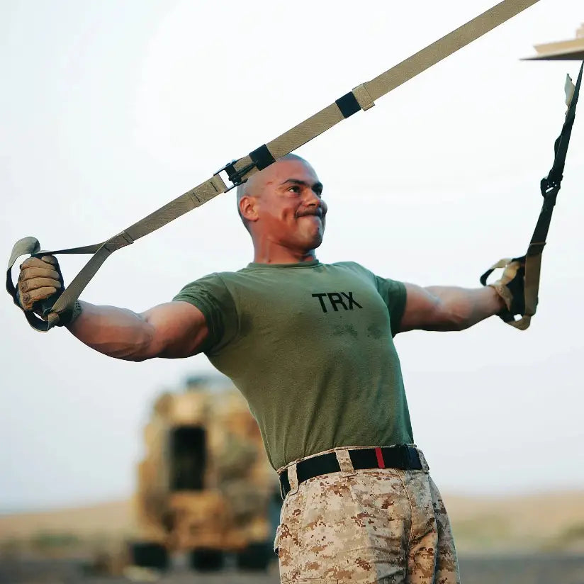 TRX Tactical Suspension Trainer – straps hanging vertically, highlighting length-adjust markers