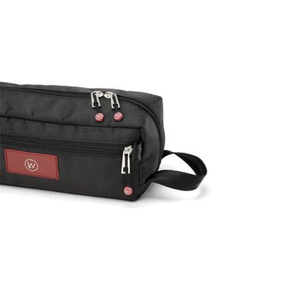 Black toiletry bag with multiple zippers and red patch.