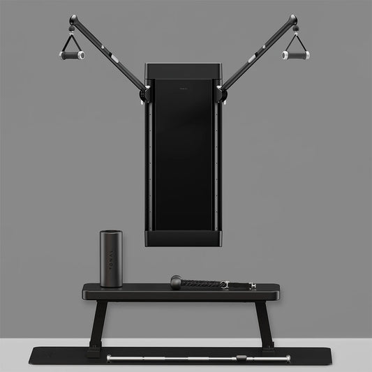 Tonal T800 trainer with dual arms and accessories on a bench.
