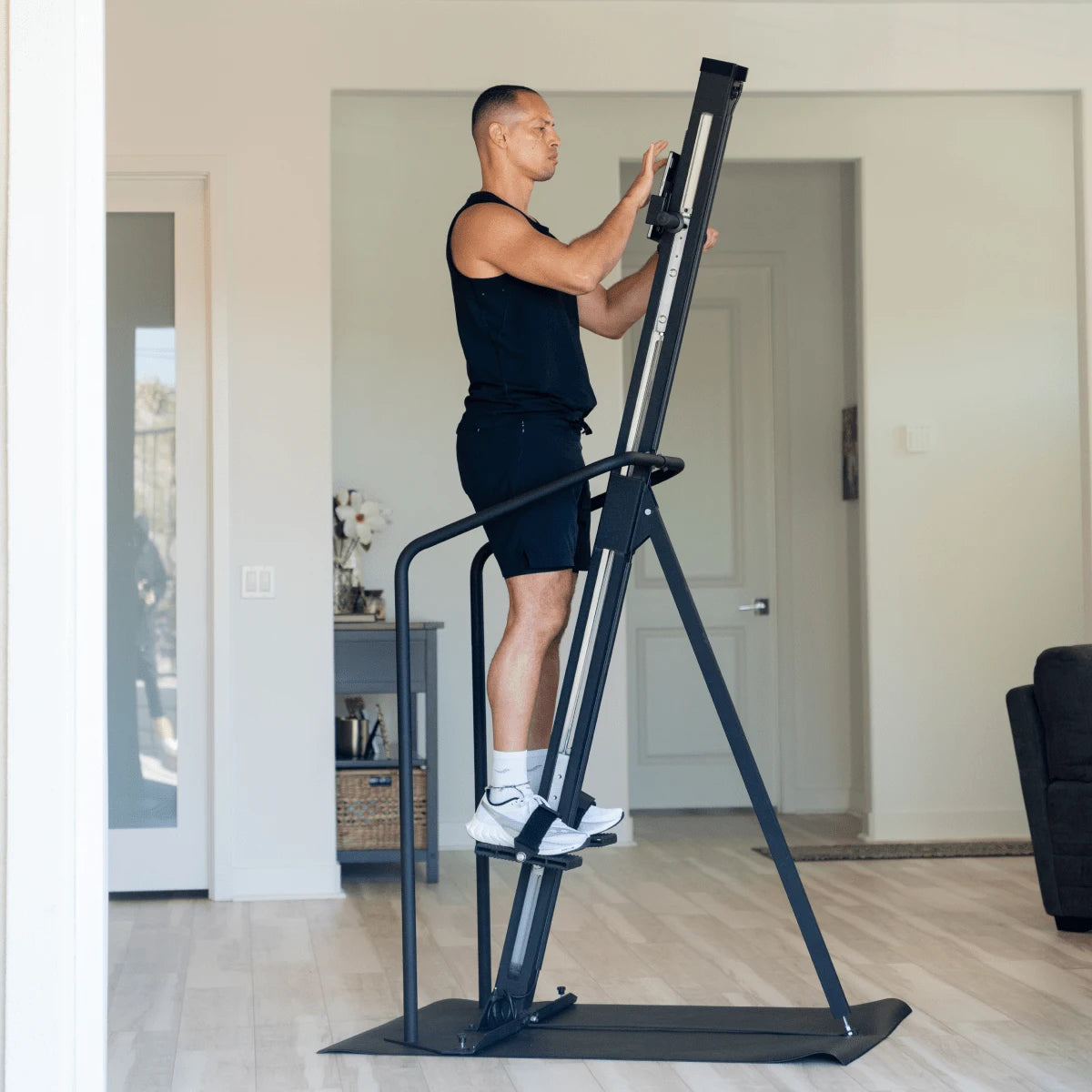 VersaClimber Home – high-intensity home cardio scene featuring vertical climber equipment