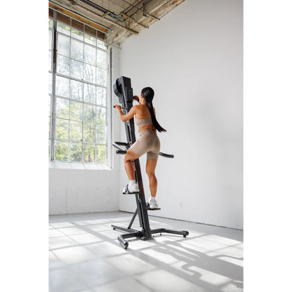 VersaClimber TS Magnetic – lifestyle shot of climber integrated into modern commercial gym setting