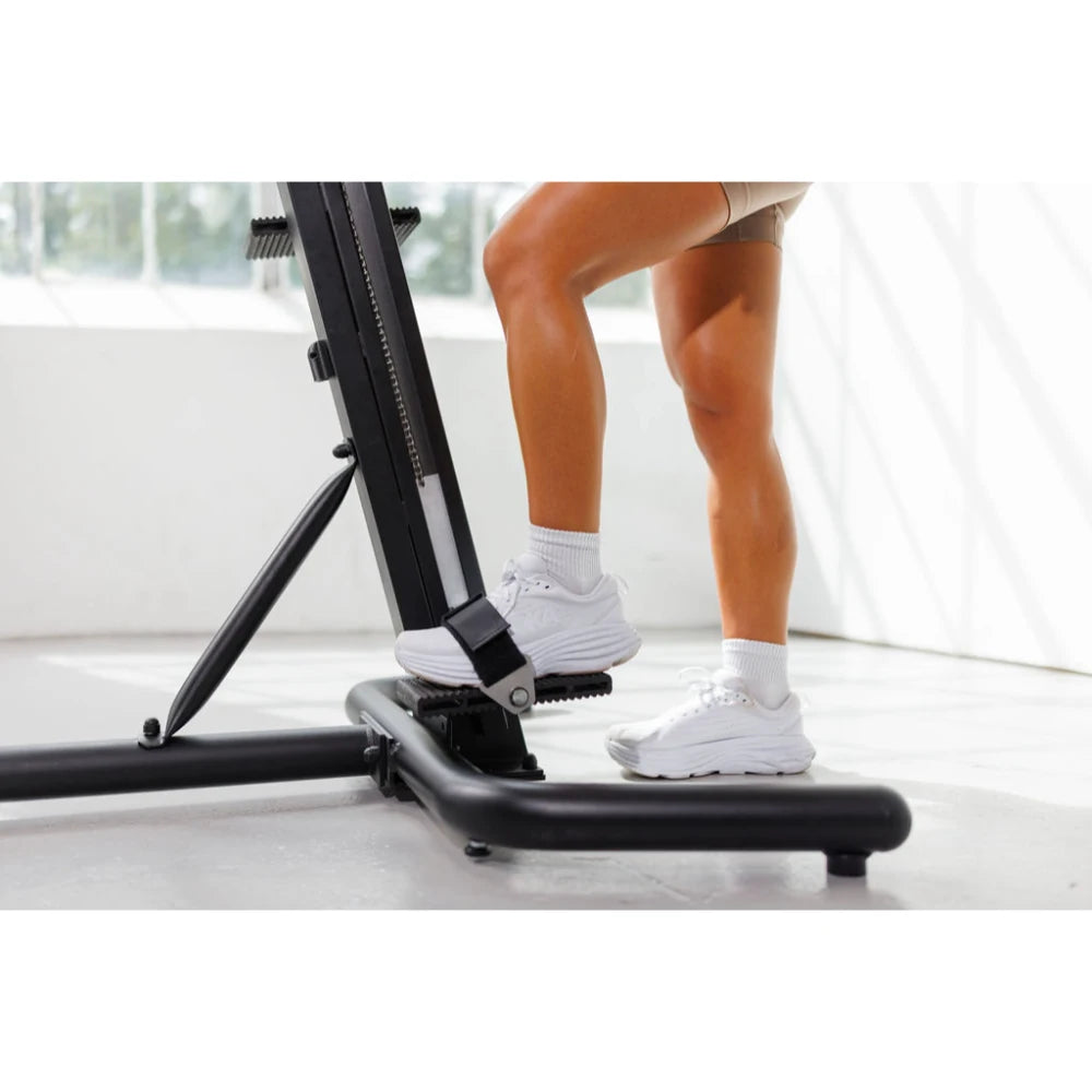 VersaClimber TS Magnetic – coach instructing client on proper climbing form using magnetic climber