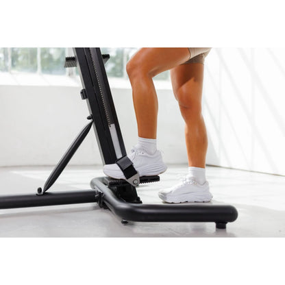 VersaClimber TS Magnetic – coach instructing client on proper climbing form using magnetic climber
