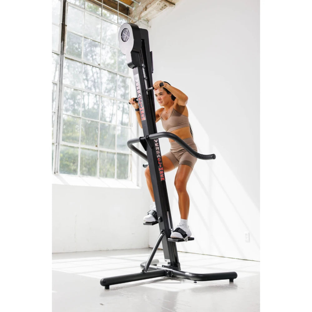 VersaClimber TS Magnetic – top-down shot focusing on foot pedals and rail design during workout